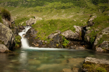Waterfall in the mountain in a cloudy day