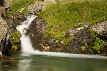 Waterfall in the mountain in a cloudy day