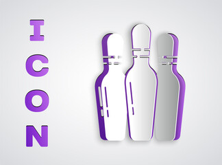 Paper cut Bowling pin icon isolated on grey background. Paper art style. Vector Illustration.