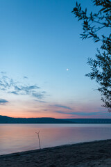 Fototapeta na wymiar Sunrise on the lake in summer season