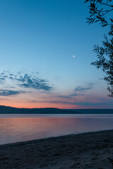 Obraz na płótnie Canvas Sunrise on the lake in summer season