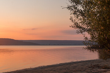 Fototapeta na wymiar Sunrise on the lake in summer season