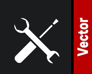 White Screwdriver and wrench spanner tools icon isolated on black background. Service tool symbol. Vector Illustration.