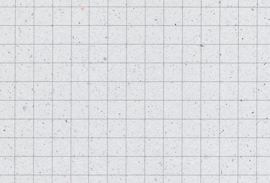 Blank grid notebook recycled paper background with inclusions of recycled paper particles. Extra large highly detailed image. Recycled paper concept.