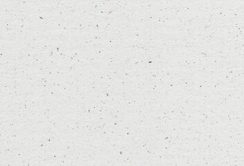 Close of view of grey paper recycled background with inclusions of paper particles. Extra large...