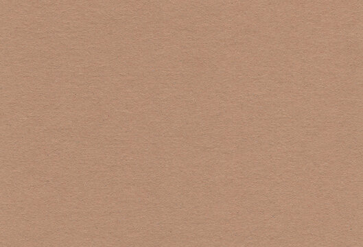 Close up view of textured brown coloured carton paper background. Extra large highly detailed image.