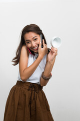 Obraz premium Studio shot of young beautiful Asian woman