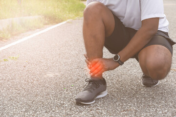 Sore ankle, man injury ankle pain after training running workout, Healthcare Concept