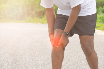 Runner leg , knee injury and muscle pain during running outdoors or Warp up before any exercise