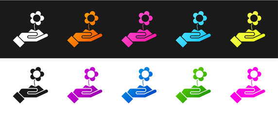 Set Hand holding flower icon isolated on black and white background. Seed and seedling. Planting sapling. Ecology concept. Vector Illustration.