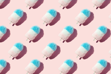 Creative pattern flat lay of pastel color fluffy fur ice cream close up with copy space on pink summer background. Minimal zine type