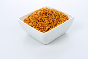 Fried and Spicy Chana Masala Dal, Chana Dal is a very popular Gujarati snack, white bowl on dark background