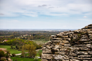 view from the top of the hill with a rock wall 