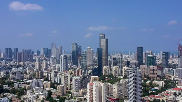 Tel Aviv skyline and skyscrapers seen from neighbouring city houses of Ramat Gan, Aerial view.