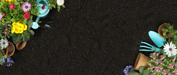 Flat lay composition with gardening tools on soil, space for text. Banner design