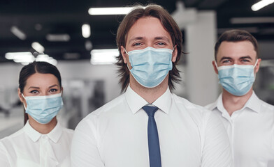 Business team in masks during epidemic