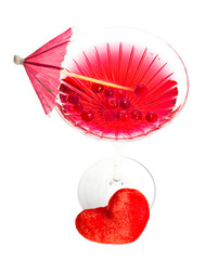 Red martini cocktail with plush heart isolated on a white background.