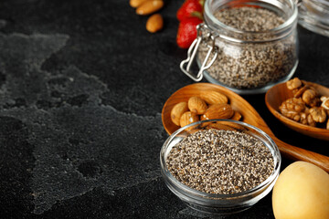 Chia seeds with berry and nuts on white table