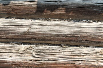 Texture background from old logs of a Russian hut.