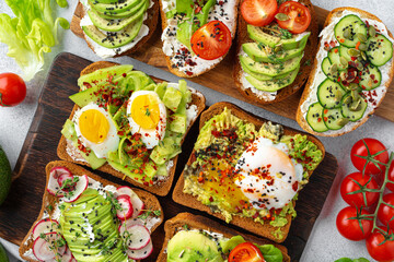 Assortment of vegan sandwiches with avocado and tomatoes