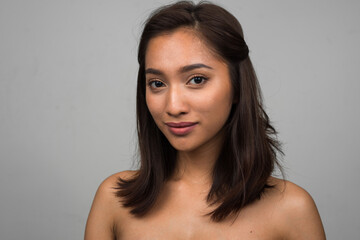 Portrait of young beautiful Asian woman shirtless