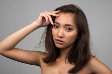 Naklejka premium Portrait of young beautiful Asian woman shirtless
