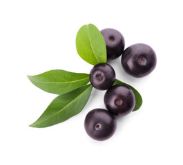 Fresh acai berries with leaves isolated on white, top view