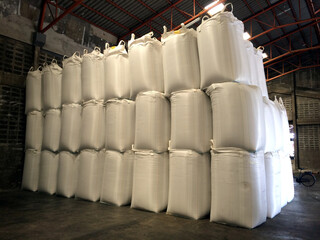 White hemp sacks containing chemical fertilizer Large  sidebar placed on wooden pallets. To wait for delivery to customers
