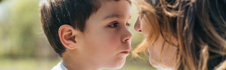 website header of cute boy looking at mother