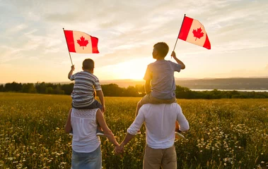 Garden poster Canada Adorable cute happy Caucasian boys holding Canadian flag on the father shoulder