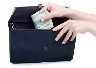Hand put money dollars in female bag on white background isolation