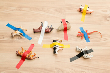 Play game. Task to unstick animals from floor board. Learning to say animal names