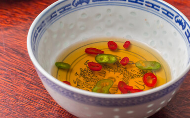 Traditional spicy asian dipping sauce with sesame oil and hot peppers