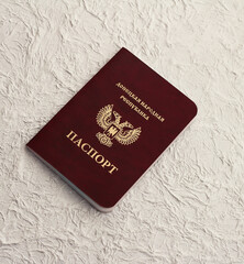 Passport of the Donetsk people's Republic on a white crumpled background. The inscription in...