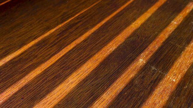 Light and Shade Pattern Streaks on Wooden Floor in Time Lapse
