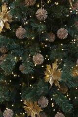 Christmas tree. New Year decorations: balls for fir-tree. Elements of New Year decor to create Christmas mood in interior. Magical lights and flickering of colorful balls, toys in holiday. Xmas party