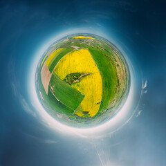 Aerial View Green Countryside Rural Yellow Canola Colza Field Meadow Landscape Sunny Spring Day. Top View Of Beautiful European Nature From High Attitude. Little Small Planet Concept