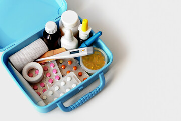 Pills, capsules, blisters, nose sprays, bottles, patches and electronic thermometer in home medical...
