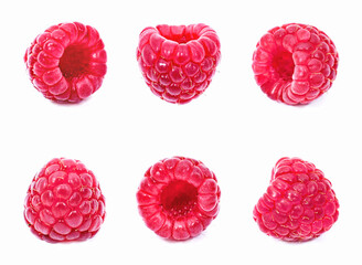 Fresh raspberries, isolated on white background. Arrangement of raspberry fruits, cut out objects, healthy eating theme.