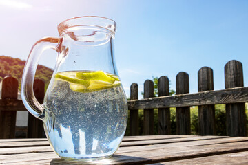 Homemade lime water in glass carafe