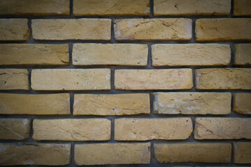 Background stone wall, yellow texture with stones.