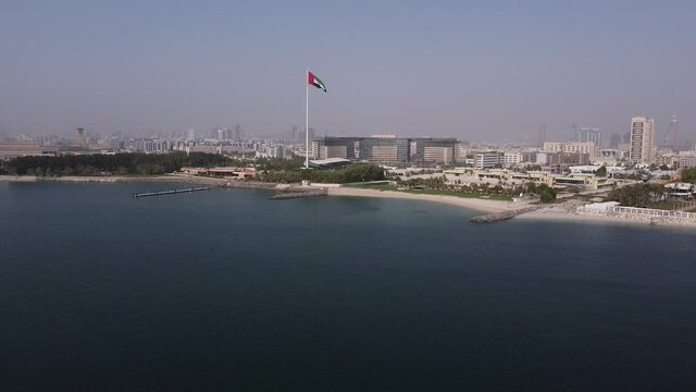Drone shot of UAE flag waving in the sky. UAE Flag day. UAE National day. 