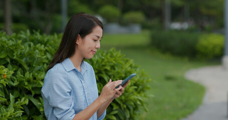 Woman check on cellphone at outdoor