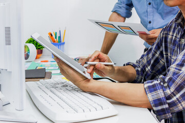 The team of website designers with the ux ui system are writing programs and laying the layer to...