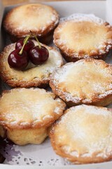 Delicious cupcakes with cherry jam on the table 