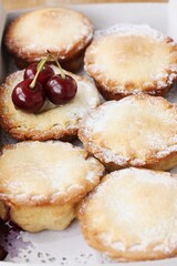 Delicious cupcakes with cherry jam on the table 