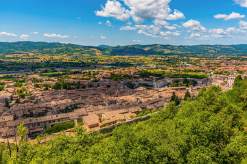 A view from the Colle Eletto cable car over the cathedral city of Gubbio, Italy towards the Apennine mountains in summer