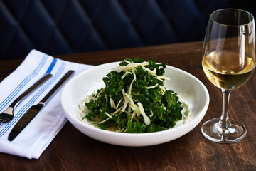 Kale Salad with Green Apple on Wooden Table