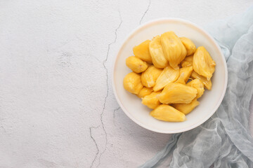 top view of slice of jackfruits in a bowl on table.