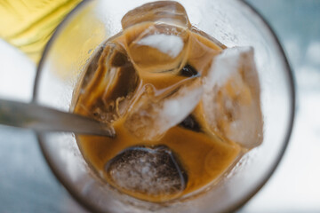 iced coffee with milk and hot tea in Vietnamese style on table. Selective Focus.